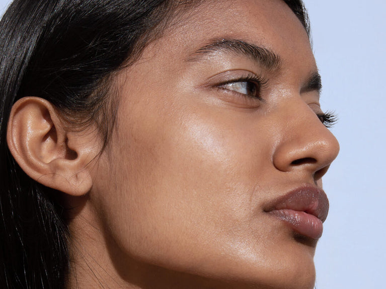 Side profile of woman with minimal makeup