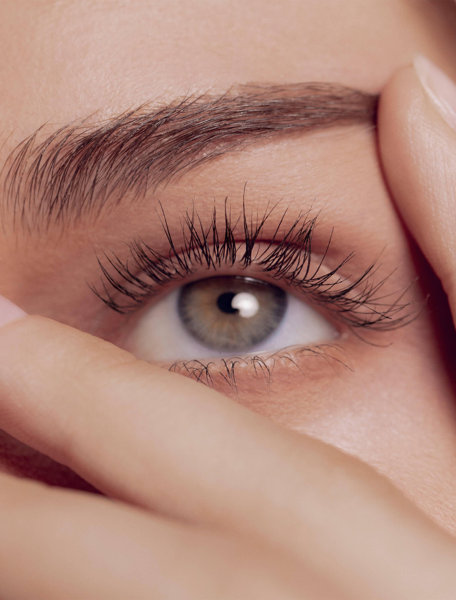 Close up with hand over face near eye