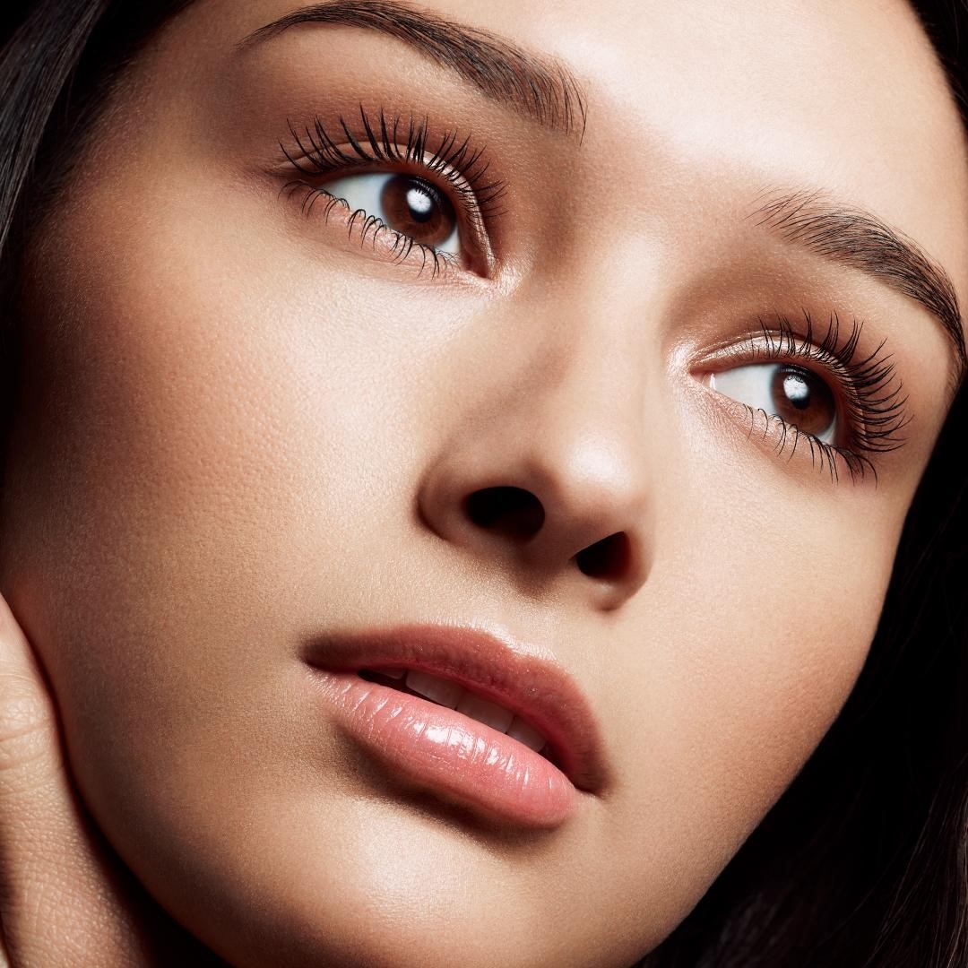 image of model staring off to the right showing off her beautiful lashes and brows.