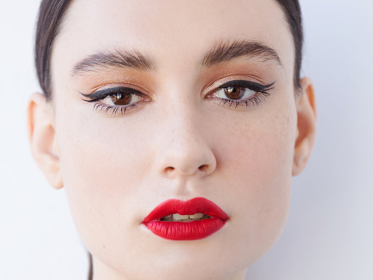 Image of model with feathered brows and red lips