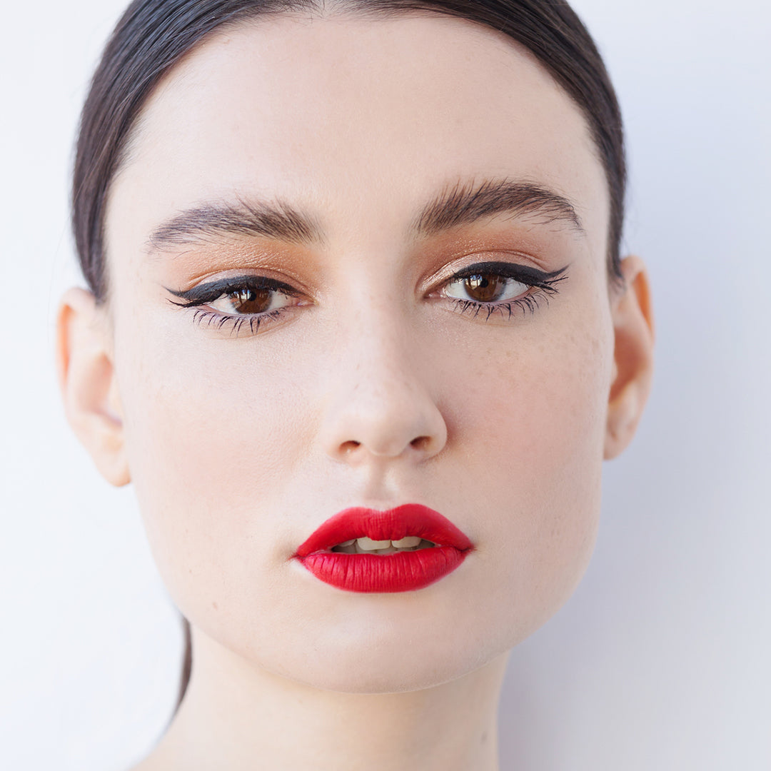 Image of model with feathered brows and red lips