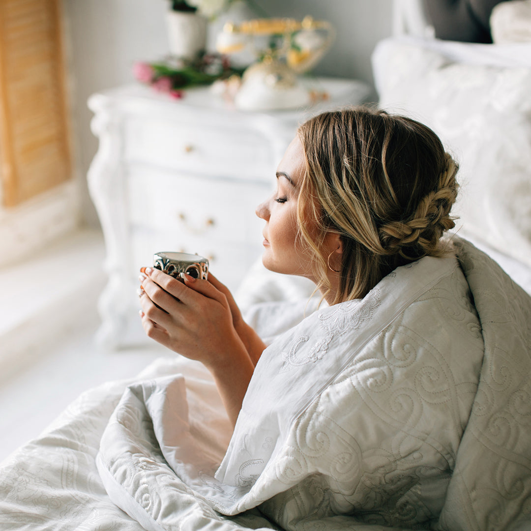 Image of woman relaxing with a cup of coffee