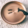 Image of magnetic lashes sitting in a copper dish