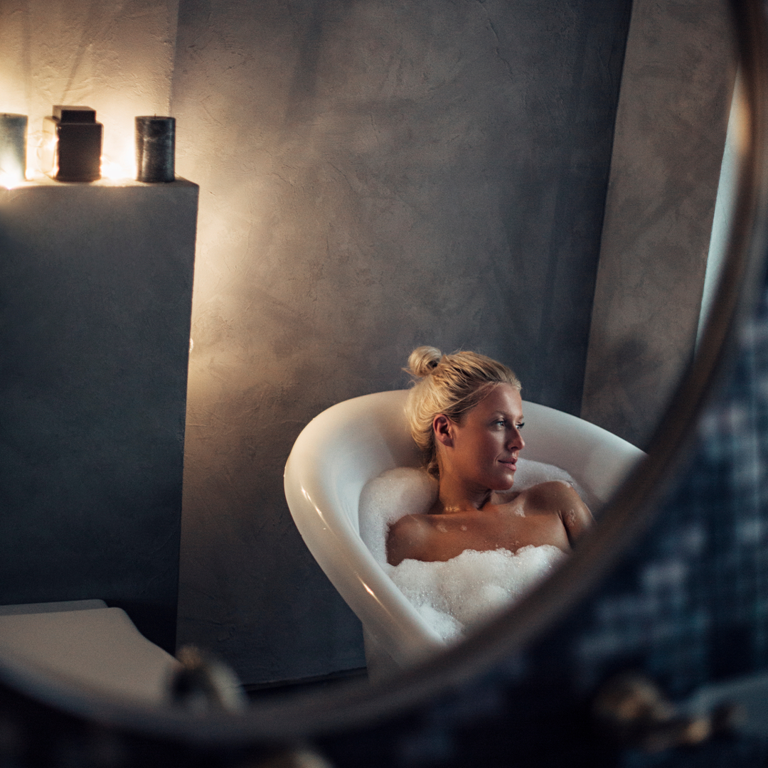Image of woman relaxing in a soapy tub