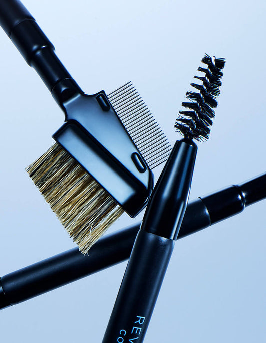 Makeup brushes with bristle and brush heads on a light blue background