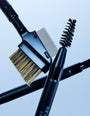 Makeup brushes with bristle and brush heads on a light blue background