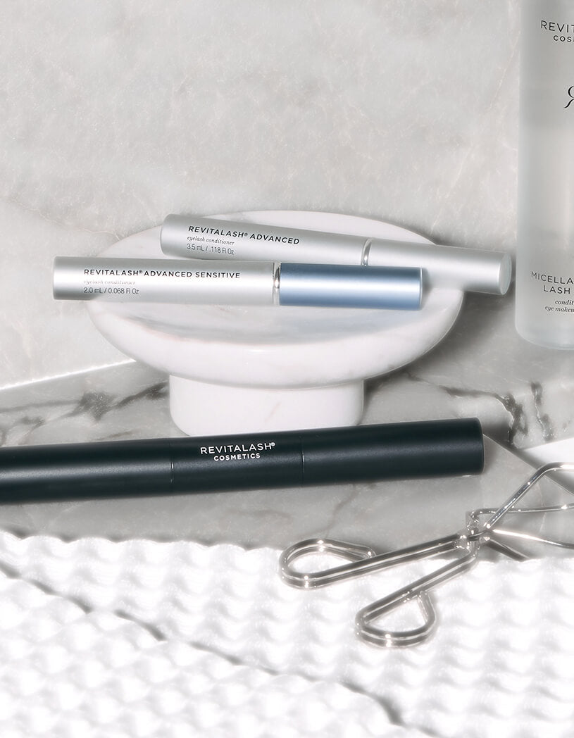 Revitalash cosmetic products on a marble surface