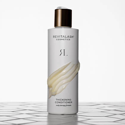 Revitalash Thickening Conditioner bottle on a white background