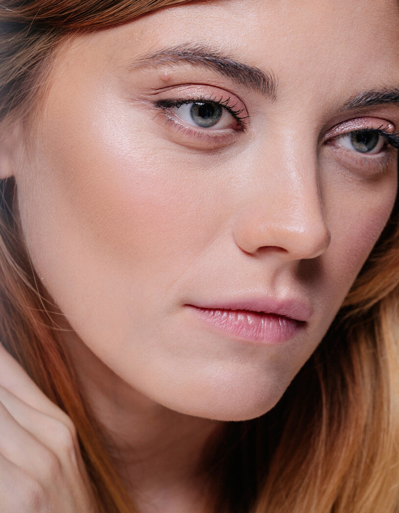 Close-up of a woman's face with a neutral expression