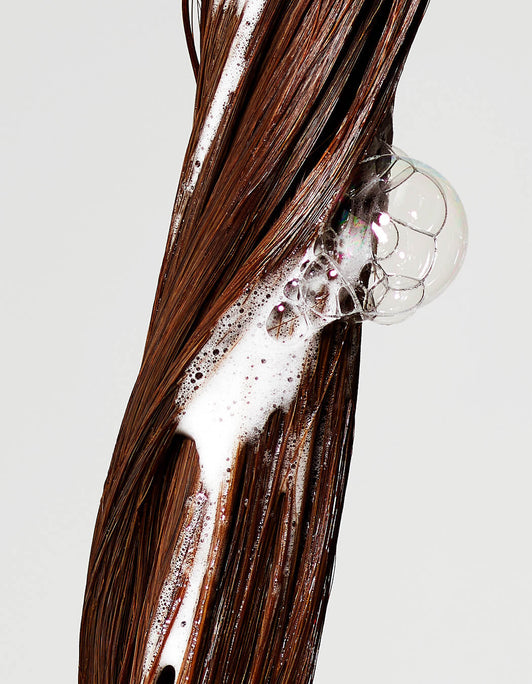 Thickening Shampoo PDP macro shot